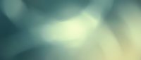 Soft blurred abstract background with warm yellow and cool teal tones blending together, creating a dreamy atmospheric effect suitable for overlays and design projects.