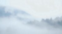 Soft gray and white clouds floating in overcast sky creating moody atmospheric background for weather forecasts and nature projects.
