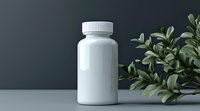 White medicine bottle with green plant leaves against dark background, minimalist pharmaceutical product presentation for healthcare and wellness marketing.