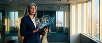 Professional businesswoman lawyer holding scales of justice in modern office with legal documents and city view through windows.