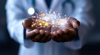 African American medical professional holds glowing magical light particles in cupped hands against dark background, representing healing and innovation in healthcare.