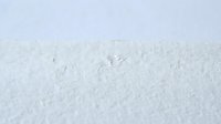 Fresh white snow surface with natural texture and small animal tracks creating winter landscape background for seasonal designs and outdoor concepts.