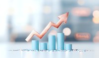 Pink arrow rising over blue bar chart columns on light background with bokeh effect, representing business growth and financial success trends.