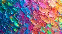 Vibrant multicolored abstract background with textured paint strokes in rainbow spectrum from blue to orange, featuring rich impasto technique and dynamic surface relief.