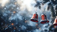 Red Christmas bells hanging on snowy pine branch with falling snowflakes and bokeh lights creating magical winter holiday atmosphere. Perfect for seasonal designs.
