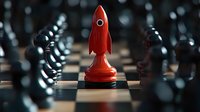 Red rocket-shaped chess piece stands out among black chess pieces on classic board, symbolizing innovation and strategic leadership in business competition.