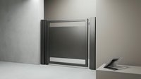 Modern stainless steel dumbwaiter elevator system installed in contemporary interior wall for efficient food and item transport between floors.