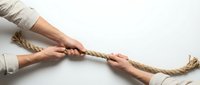 Business teamwork concept with hands pulling rope together showing collaboration and unity in corporate environment for leadership training.