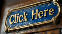 Vintage brass click here sign with blue patina background and ornate frame details, shallow depth of field creates nostalgic mood for web design and UI elements.