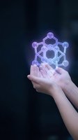 Hands holding glowing molecular structure hologram representing chemistry, science research, biotechnology innovation and digital transformation concepts.