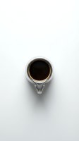 White ceramic coffee cup filled with black coffee viewed from above on clean white background for minimalist cafe and beverage design projects.