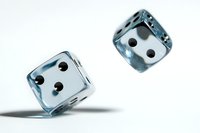 Transparent blue glass dice in motion against white background, showing different angles and casting soft shadows, isolated for design projects and gaming concepts.