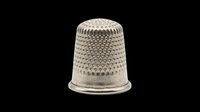 Silver metal sewing thimble isolated on transparent background, ready for crafting clipart, stickers, print on demand, sublimation, and t-shirt design use.