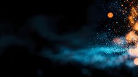 Magical glowing particles with blue smoke effect against dark background create atmospheric mood with bokeh lights and dynamic motion blur.