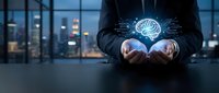 Business professional holding glowing digital brain hologram with circuit patterns in modern office, representing artificial intelligence and innovation.