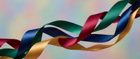 Colorful satin ribbons flowing gracefully against soft pastel background. Elegant curved silk bands in green, blue, red, gold creating dynamic movement.