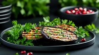 Grilled eggplant slices garnished with fresh parsley and pomegranate seeds on black plate. Charred vegetables with herbs create appetizing Mediterranean dish.