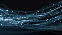 Abstract flowing blue fiber optic strands with glowing light particles against dark background, creating futuristic technology concept for digital communications.