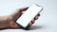 Male hand holding modern smartphone with blank white screen mockup for app presentation and mobile interface design on neutral background.