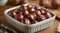 Fresh roasted chestnuts in ceramic dish on wooden table, traditional autumn seasonal food ready for holiday cooking and festive meals.