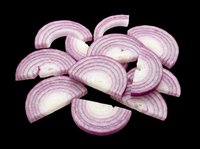 Sliced red onion pieces isolated on transparent background, ready for food design, stickers, print on demand, T-shirts, sublimation, and clipart projects.