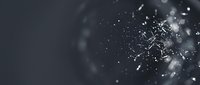 Abstract digital sphere shattering into glowing particles and fragments against dark background, representing data explosion, technology disruption, or digital transformation concepts.