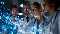 Diverse medical team analyzing holographic data visualization in modern hospital setting. Blue glowing network connections represent healthcare technology.