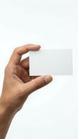 Hand holding blank white business card mockup isolated on white background for branding and corporate identity design projects.