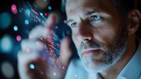 Middle-aged Caucasian businessman with gray beard interacting with futuristic holographic digital interface displaying colorful data visualization and network connections.