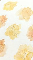 Watercolor abstract floral pattern with golden yellow blooms on textured paper background for artistic design projects and creative applications.