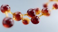 Red glossy molecular structure with interconnected spheres and golden bonds against light background, representing scientific concept or chemical compound.