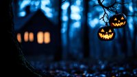 Spooky Halloween night scene with glowing jack-o-lantern pumpkins hanging from tree branch and haunted house silhouette in misty blue forest background.