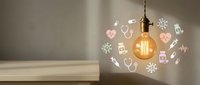 Glowing vintage Edison bulb hanging near a shelf with colorful medical icons projected on the wall, symbolizing healthcare innovation and ideas.