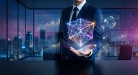 Professional businessman holding glowing geometric network structure with digital data analytics charts and graphs in modern office environment.