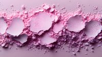 Crushed pink makeup powder texture with circular imprints and scattered particles creating abstract pattern on light background. Professional cosmetics macro photography.