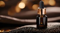 Dark amber glass dropper bottle with essential oil on glittering surface against warm bokeh background, creating luxurious spa and wellness atmosphere.