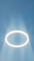 Glowing white neon oval ring floating against soft blue gradient background with light rays emanating outward, isolated design element for digital projects and creative compositions.