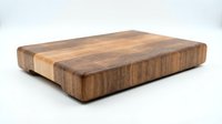 Wooden cutting board with end grain construction featuring mixed wood tones, isolated on white background, ready for kitchen and culinary design projects.