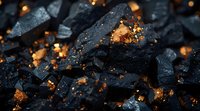 Black coal pieces with golden glowing embers and sparks, creating dramatic contrast for energy and industrial concepts. Perfect for environmental or resource themes.