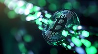 Glowing cryptocurrency coin with green bokeh lights background creates futuristic digital money concept for financial technology and blockchain innovation.