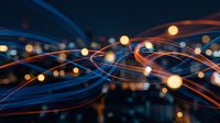 Abstract digital network with flowing blue and orange light trails intersecting across dark background, representing data flow, connectivity, technology infrastructure and communication systems for web design and tech concepts.