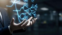 Businessman holding glowing blue neural network and circuit patterns in hands, representing artificial intelligence, technology innovation, and digital transformation in modern business environment.