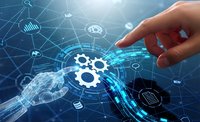 Human hand pointing at digital gear interface with glowing network connections and technology icons on blue background for business automation concepts.