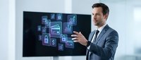 Professional businessman presenting digital technology icons on screen during corporate meeting for business analytics and data visualization.