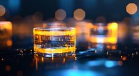 Glass of whiskey on dark background with golden bokeh lights creating luxurious atmosphere. Amber liquid reflects warm glow in crystal tumbler.