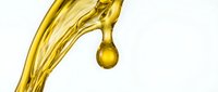 Golden oil or liquid pouring with a single droplet suspended against white background, isolated for design use on packaging, labels, and promotional materials.