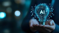 Businessman holding glowing digital lightbulb with AI text and circuit board pattern representing artificial intelligence innovation and technology solutions.