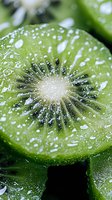 Fresh juicy kiwi slice with water drops in macro view showing detailed texture and seeds, vibrant green color and white center core for food and health concepts.