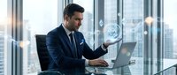 Professional businessman in dark suit working with holographic data visualization and laptop in modern office with city skyline view during daytime.