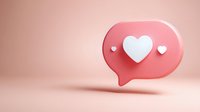 Pink speech bubble with white heart floating on soft pink background for social media engagement and online dating concepts.